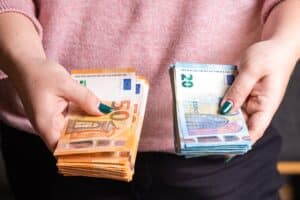 business, finance, saving, banking and people concept close up of woman hands counting euro money