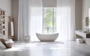 elegant modern bathroom with freestanding tub and large window for natural light